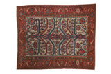 Antique Malayer rug with serrated leaves and a Herati border in red, blue, and ivory.