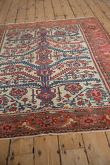 Low angle view of a fine antique Malayer rug showing its intricate serrated leaf and vine pattern.