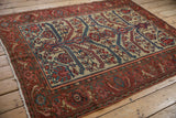 Angled perspective of a fine antique Malayer rug with complex geometric leaf motifs.