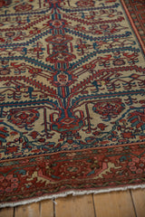 Close perspective on the hand-knotted pile of a Malayer rug with serrated leaf and palmette motifs.