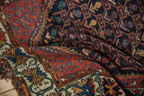 Vintage Kurdish Hamadan rug featuring its crab style floral border and geometric vinery.