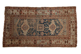 Vintage Caucasian rug with triple medallion, geometric motifs in navy blue, beige, and rust, 3'8