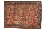 Vintage Persian Tabriz rug with a Safavid-inspired floral pattern in rust, navy blue, and sand tones.