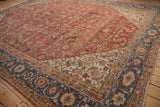 Vintage Sultanabad carpet: sapphire blue Herati main border, ivory spandrel, brick red field.
