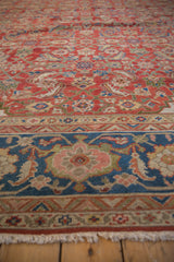 Vintage Sultanabad carpet: sapphire blue Herati border, brick red field, and ivory fringe.