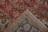 Folded corner of a vintage Sultanabad carpet, revealing sapphire blue spandrel and even pile wear.