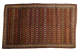Antique Bijar carpet with a field of staggered botehs in a dynamic palette of navy, red, and saffron yellow.