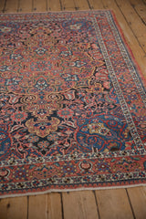 Angled view of a vintage Isfahan rug showing its intricate traditional pattern and low, even pile.