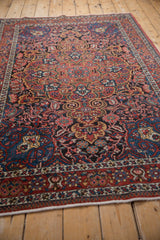 Low angle perspective of a vintage Isfahan rug, emphasizing its allover floral and leaf pattern.