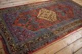 Vintage Bijar runner border with aquatic blue wave design and floral motifs.