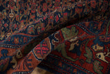 Curled Vintage Bijar rug detail: Herati field, mythical animal border in navy, cherry red.