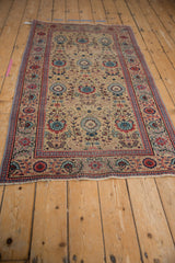 Vintage Tabriz runner: sand field, powder blue and brick red palmette motifs, worn pile.