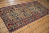 Vintage Tabriz runner: intricate sand, powder blue, brick red palmette and blossom field with foundation wear.