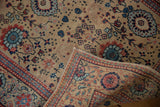 Folded vintage Tabriz runner edge, revealing machine binding, worn foundation, and blue palmettes.