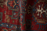 Hand-knotted pile and knot heads of a vintage Karaja rug in cherry red and sapphire blue.