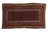 Vintage Kurd rug with staggered botehs on a dark navy field and a rust geometric main border.