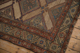 Detailed texture of a fine antique Kurd rug, showing the geometric border and knot heads.