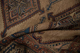 The even wear to the knot heads and hand-knotted texture of an antique Kurd rug's geometric pile.