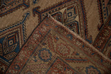 Folded corner of an antique Kurd rug showing the fine hand-knotted weave and geometric pile.