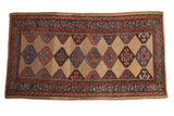 Vintage Kurd rug runner with blue, red, brown serrated guls on an abrashed camel field, 3'1