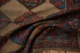 Serrated guls and abrashed camel ground texture on this vintage Kurd runner.