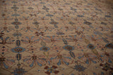 Angled detail of fine Bibikabad carpet, camel field with sapphire, blush, and copper floral vine motifs.