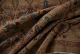 Folded detail of vintage Bibikabad carpet, showing sapphire blue floral motifs and turtle Samovar border.