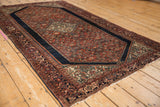 Vintage Farahan Sarouk rug with deep madder red Herati field, navy blue Turtle Samovar border, and ivory medallion.