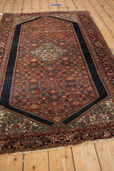Exquisite diamond medallion, hook outlines, and madder red Herati pattern close-up.