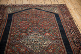 Vintage Farahan Sarouk rug: madder red Herati field meets dark navy Turtle Samovar border.