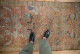Distressed Malayer runner with faded copper and sky blue arabesque floral-geometric patterns.