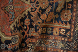 Mehriban rug's intricate border detail with navy blue, madder root rust, and ivory motifs.