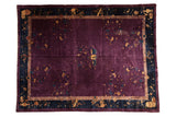 Vintage Nichols carpet with plum field, delicate garden vines, and navy cloudband borders, 9' x 11'7