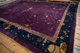 Chinese Nichols carpet corner with plum field, navy border, gold vinery, cloudband, and vase motif.