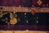 Vintage Nichols carpet border features plum, brown, and navy bands with white fringe.