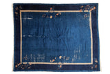Vintage Peking carpet, rich blue field with blossom vine borders, areas of wear, 9'2