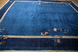 Vintage Peking carpet corner, indigo blue field, floral vinery, beige and cobalt borders.