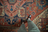 Hand knotted antique Serapi carpet detail: madder root red, navy, and blush palmette field, even wear.