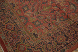 Corner of vintage Mahal carpet, showing madder red floral field and Samovar border.