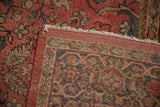 Folded vintage Mahal carpet corner: madder root red floral pile, ivory fringe, and detailed reverse.