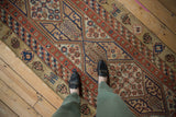 The traditional geometric design of an antique Serab runner shown in-situ for scale and color.