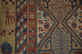 Stylized checkered animal and finned plant motifs on an antique hand-knotted Serab runner.