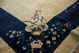Vintage Chinese Peking carpet: pictorial cobalt blue border with sky blue and beige blossoms.