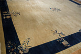 Cobalt blue border with pictorial vase and blossom motifs on vintage Peking carpet.
