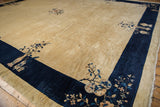 Peking carpet corner: beige field, cobalt blue border with pictorial vases and blossoms.