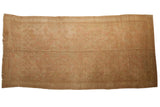 Vintage distressed Oushak carpet, allover faded palmette and quatrefoil design in beige and dusty rose.