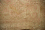 Distressed Oushak carpet, soft wool texture with beige, sand, and pink tones.
