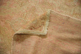 Vintage Distressed Oushak carpet displaying textured beige, blush pile and woven reverse.