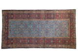 Antique Persian Fereghan carpet with an allover Herati motif on a powder blue field, framed by a wide madder red border.