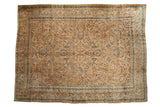 Distressed vintage Persian Meshed rug, allover palmettes and vinery in sand, gold, and indigo.